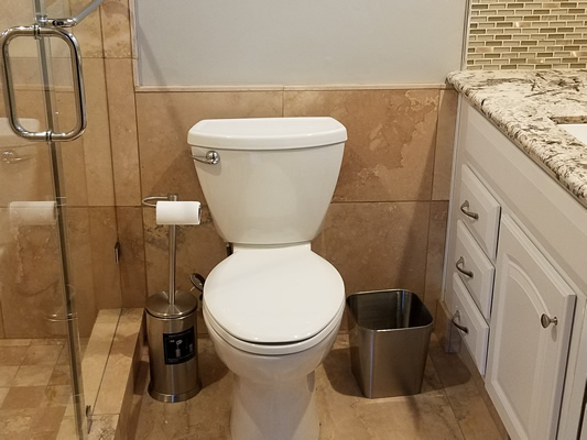 Granite Floor, Shower & Bathroom Countertop at Cole St. by The Beautiful Home Company