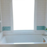 Bathroom Tub, Tile & Wood Flooring at 206 Bixby by The Beautiful Home Company