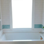 Bathroom Tub, Tile & Wood Flooring at 206 Bixby by The Beautiful Home Company