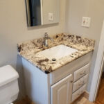 Bathrooms - Granite Counter Top at Cole Street Property by The Beautiful Home Company