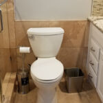 Bathrooms - Granite Shower, Floor and Counter Top at Cole Street Property by The Beautiful Home Company