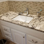 Bathrooms - Granite Counter Top and Tile Back Splash at Cole Street Property by The Beautiful Home Company