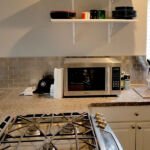 Kitchens - Granite Counter Top and Tile Back Splash at Cole Street Property by The Beautiful Home Company