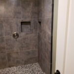 Bathrooms - Granite Shower at Susan Hill Property by The Beautiful Home Company