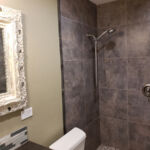 Bathrooms - Granite Shower at Susan Hill Property by The Beautiful Home Company